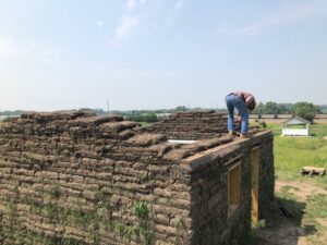 Sod house in Broken Bow's walls grow taller, ready for roof