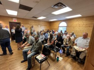 Thedford, Senator Jacobsen help hatch new Halsey egg at community meeting