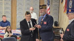 Local WWII veteran Wayne Mills presented recognition medal