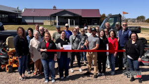 Kahnk Lawncare cuts ribbon with Broken Bow Chamber of Commerce