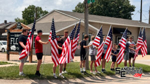 VIDEO: Flags fly for WWII veteran Wayne Mills