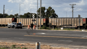 Train impacts truck pulling farm equipment at east Broken Bow crossing