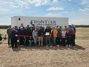 Frontier Lawn & Sprinkler LLC cuts ribbon with Broken Bow Chamber of Commerce
