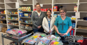 Local assisted living home makes cake kit donation to food pantry