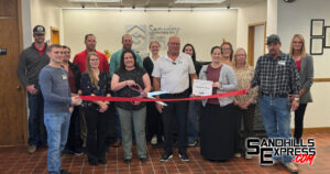 Security First Bank cuts red ribbon in Broken Bow with Chamber of Commerce